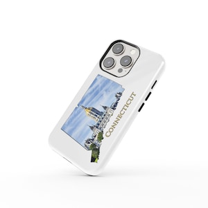 May include: White iPhone case featuring a colourful image of the Connecticut State Capitol building and the word "CONNECTICUT" in gold lettering.