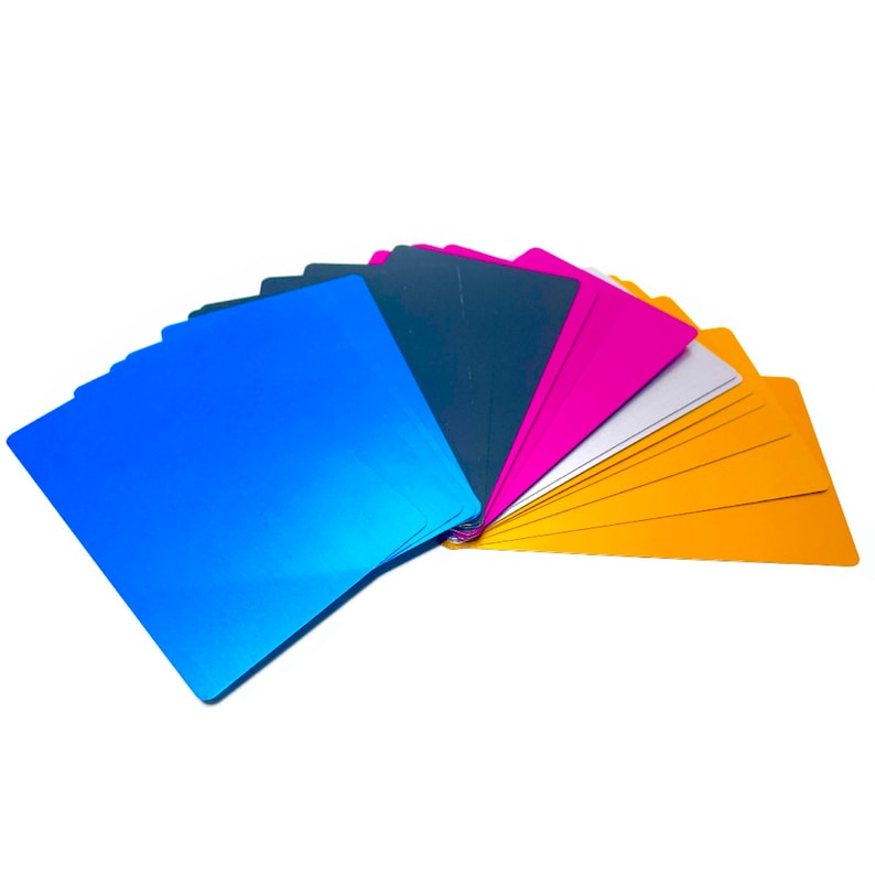 May include: A fan of colorful metallic cardstock in shades of blue, gold, silver, pink, and gray.