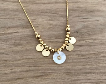 Gaia Disc Necklace in Gold and White Mother Of Pearl with a Zirconia on a thin chain