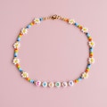 Personalized Flower Necklace: A Unique Rainbow Gift with your name. product logo