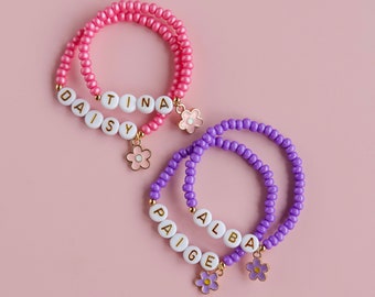 Personalised flower charm bracelet - pink/purple child's name bracelet.