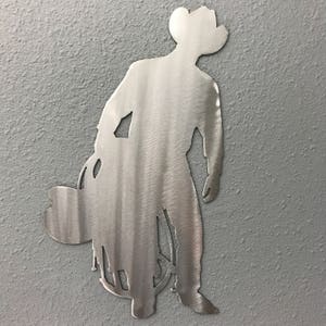 Cowboy and saddle Metal Wall Art Decoration Skilwerx  12x6 Western cowboy