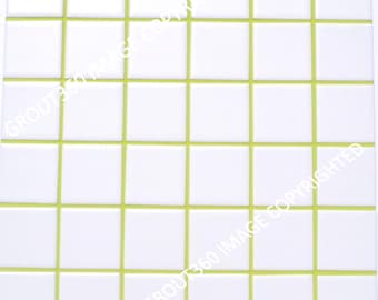 May include: A square tile sheet featuring a grid of white, square tiles with bright green grout lines. The tiles are arranged in a repeating pattern, creating a clean, modern aesthetic. The image is a close-up shot.