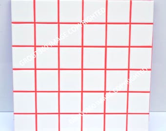 May include: White square tiles with red grout lines, arranged in a grid pattern. The tiles are evenly spaced, creating a clean and modern look. The red lines provide a striking contrast against the white tiles.