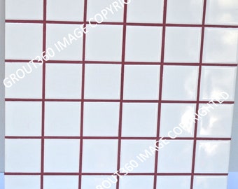 May include: White square tiles with dark red grout lines, arranged in a grid pattern. The tiles are clean and evenly spaced, creating a simple, geometric design. This tile is suitable for a bathroom or kitchen.