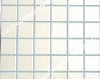May include: A square tile sheet composed of small, off-white square tiles. The tiles are arranged in a grid pattern with light blue grout lines separating them. The surface of the tiles appears smooth and reflective.