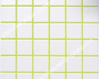 May include: Square white tiles with bright green grout lines. The tiles are arranged in a grid pattern, creating a clean and modern look. The image is a close-up, showcasing the texture and color contrast between the white tiles and the green grout.