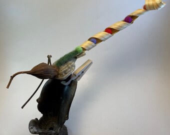 Bird with wood shaving tail