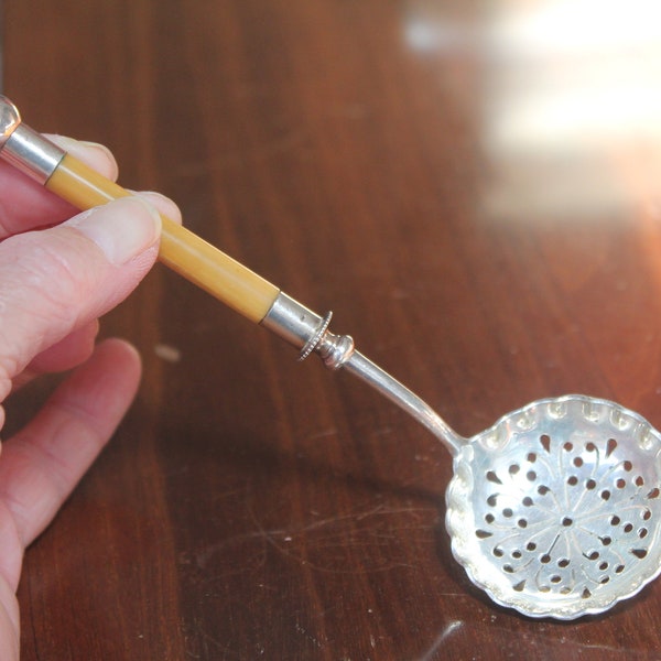 Antique Sugar Sifter silver plate & celluloid pierced spoon w/ cream colored handle Beautiful and unusual piece for tea or service use