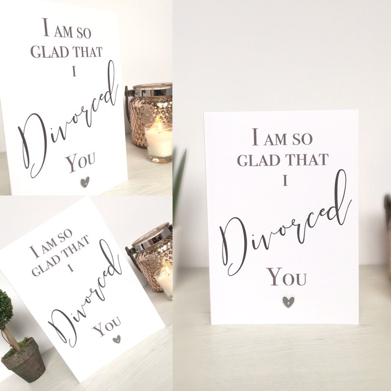May include: Two white cards with black text that reads "I am so glad that I divorced you" with a small gray heart at the bottom of each card.