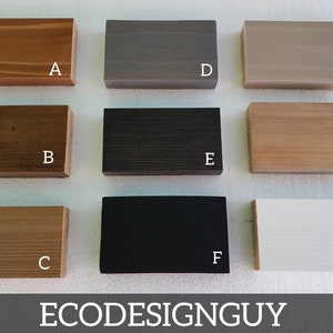 May include: Nine wood samples in different colors and finishes, labeled A through I. The samples are arranged in three rows of three. The colors include natural wood, dark brown, light brown, gray, black, and white.