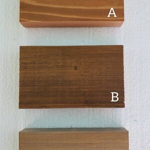 May include: Three wooden samples labeled A, B, and C. Sample A is a light brown wood with a smooth finish. Sample B is a dark brown wood with a rougher finish. Sample C is a medium brown wood with a smooth finish.