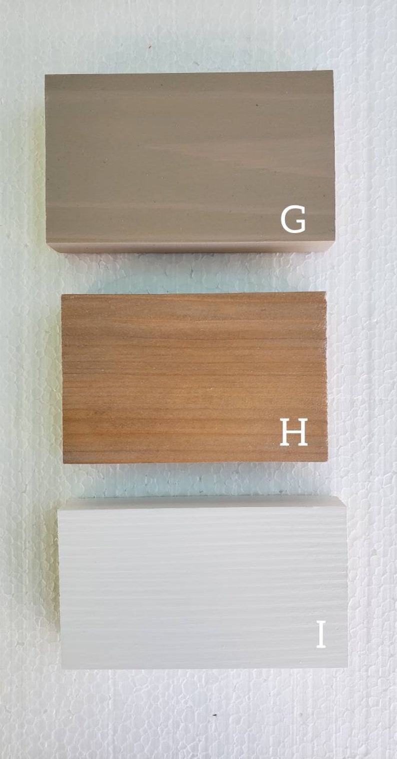 May include: Three wood samples, labeled G, H, and I. The sample labeled G is a light brown color, the sample labeled H is a medium brown color, and the sample labeled I is white.