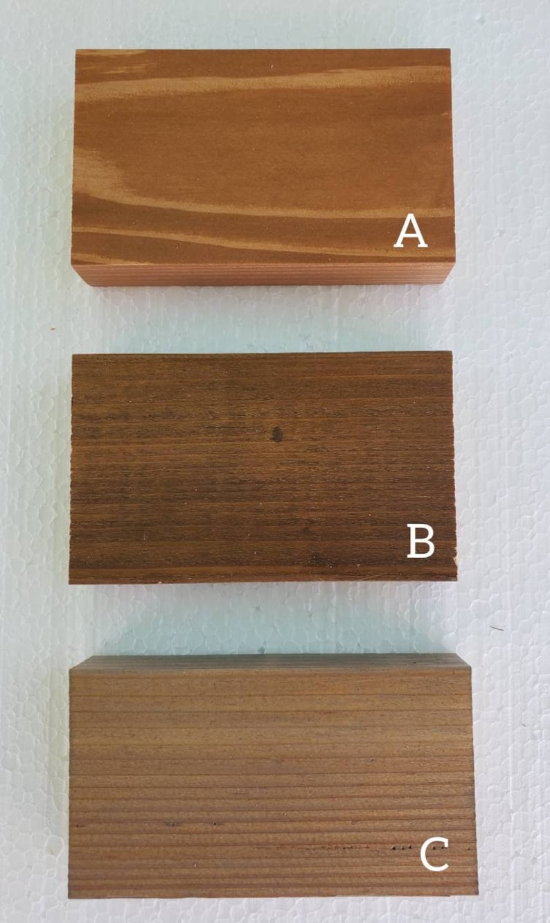 May include: Three wooden samples labeled A, B, and C. Sample A is a light brown wood with a smooth finish. Sample B is a dark brown wood with a rougher finish. Sample C is a medium brown wood with a smooth finish.