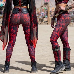 May include: A white ceramic mug with a black handle and the text "But First, Coffee" in a black, bold font. The mug is sitting on a white surface. The mug is approximately 4 inches tall.