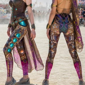 May include: A white ceramic mug with a black handle and the text "But First, Coffee" in a black, handwritten-style font. The mug is on a white surface.