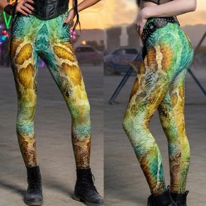 May include: A set of three ceramic mugs with a speckled, matte finish. The mugs are in shades of cream, light gray, and dark gray. Each mug has a simple, minimalist design and a rounded handle.