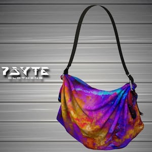 May include: A purple, orange, and yellow abstract print tote bag with a black adjustable shoulder strap. The bag has a  "PSYTE CLOTHING" logo on the front.