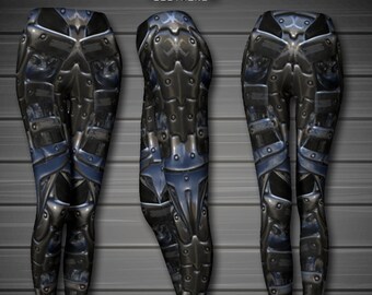 May include: Black leggings with a metallic blue and silver pattern resembling armor. The leggings have a high waist and a tight fit.