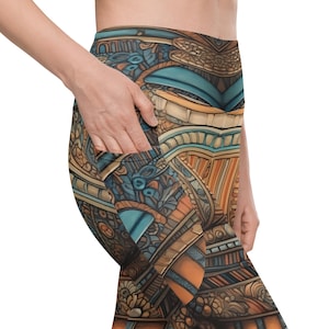 May include: High-waisted leggings with a colorful, intricate pattern in shades of blue, orange, and brown. The leggings feature a pocket on the side. The design has an ornate, architectural feel.