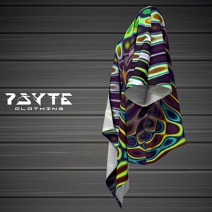 May include: A colorful, abstract patterned shirt with a white collar and short sleeves. The shirt has a swirling, psychedelic design with shades of green, blue, purple, and yellow.