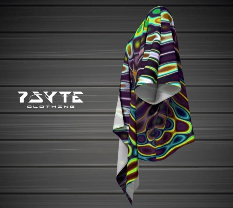 May include: A colorful, abstract patterned shirt with a white collar and short sleeves. The shirt has a swirling, psychedelic design with shades of green, blue, purple, and yellow.