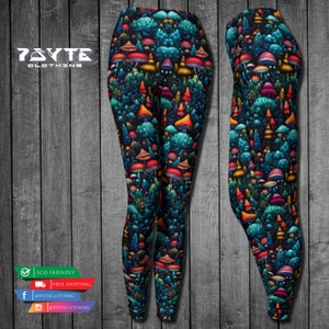 May include: Vibrant leggings with a forest and mushroom pattern. The leggings have a dark background with detailed illustrations of trees and mushrooms in red, orange, yellow, and blue. The brand name "7SYTE CLOTHING" is visible.
