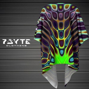 May include: A green, blue, and brown psychedelic patterned shirt with a short sleeve and a tie-dye effect. The shirt has a large, abstract design with a green, blue, and brown color scheme. The shirt is made of a soft, comfortable material and is perfect for everyday wear.