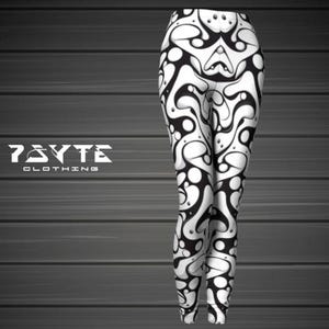 May include: Black and white leggings with an abstract pattern. The leggings feature a repeating design of organic shapes and curves. The brand name "7BYTE CLOTHING" is printed in white on the left side of the image.