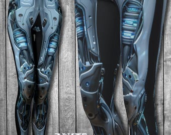 May include: Black leggings with a silver and blue robotic design. The leggings feature a detailed pattern of gears, wires, and circuits.