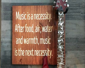 Music is a necessity Guitar Wall Hanger