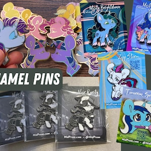 May include: A collection of enamel pins featuring various cartoon characters. The pins are colorful and feature a variety of designs, including a unicorn, a pegasus, a dragon, and a cat. The pins are all in a clear plastic bag and are ready to be shipped.