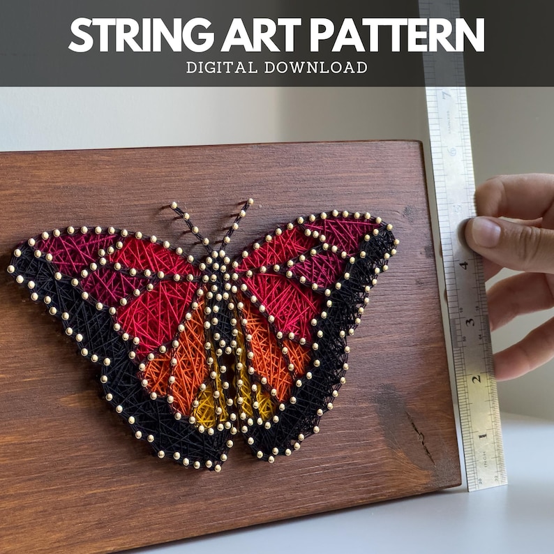 Butterfly string art pattern on wooden board with ruler for scale – digital download template for DIY thread art project.