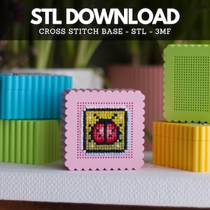 May include: The image displays colorful cross-stitch bases in various colors, including pink, blue, green, and yellow. A pink base features a cross-stitched ladybug design. The text "STL DOWNLOAD" and "CROSS STITCH BASE - STL - 3MF" are visible at the top.