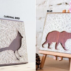 Stress relief craft kit for adults with cardinal bird and bear string art designs on stained wood base, relaxing DIY wall decor project.