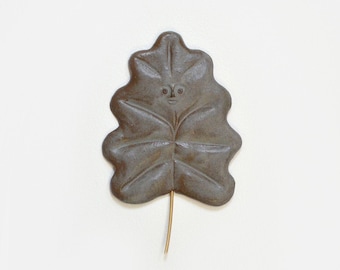 Blue brown leaf. Ceramic wall sculpture