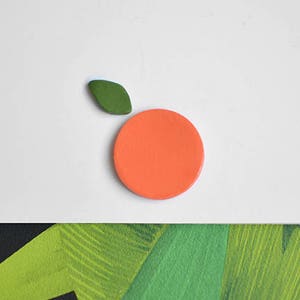 An orange. Ceramic pin. Fruit jewelry