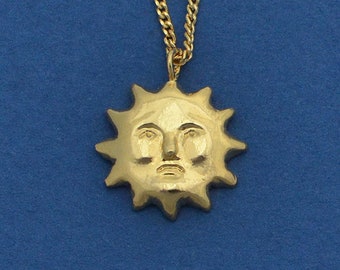 Sad Sun. Gold-plated necklace pendant