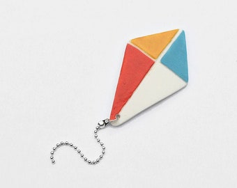 Kite pin. Colorful porcelain