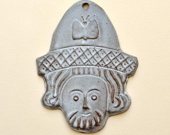Butterfly Man, folk art wall hanging. Medieval ceramic face