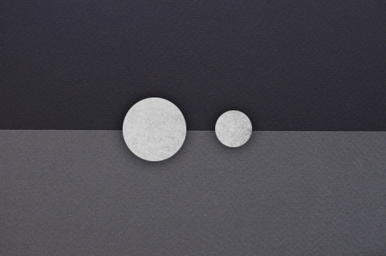 Asymetrical stud earrings. Silver disks image 2