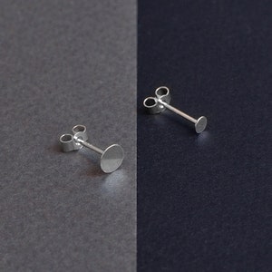 Asymetrical stud earrings. Silver disks image 4