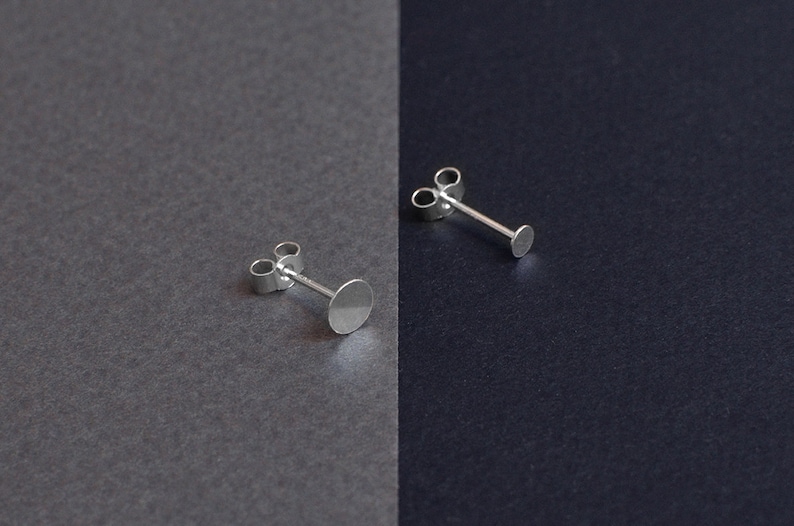 Asymetrical stud earrings. Silver disks image 4