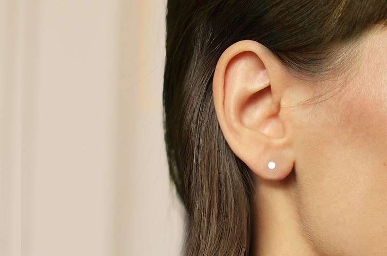 Asymetrical stud earrings. Silver disks image 5