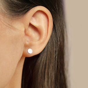Asymetrical stud earrings. Silver disks image 6