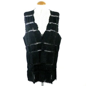 May include: Black crochet vest with a V-neck and a geometric pattern.