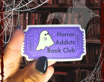May include: Purple ticket with a white ghost and the text "Horror Addicts Book Club" with the numbers 66601 on either side.