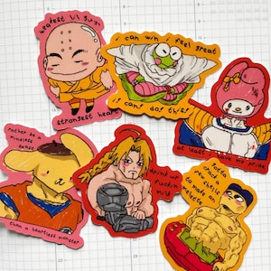 May include: A collection of colorful, hand-drawn stickers featuring various cartoon characters. Each sticker has a unique design with text, including phrases like "strongest heart" and "can do this!" The stickers are on a white grid background.