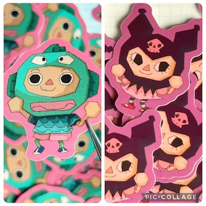 May include: A collection of colorful stickers featuring cartoon characters. One sticker depicts a character in a teal helmet and outfit, while others showcase a character with a skull-shaped head and a purple outfit. The stickers are on a pink background.