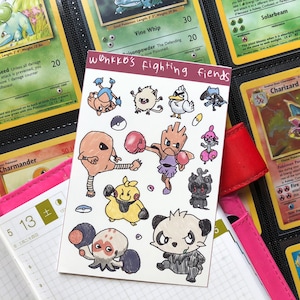 May include: A set of 10 Pokemon fighting fiends stickers. The stickers are hand-drawn and feature various Pokemon characters in fighting poses. The stickers are printed on white paper and have a red border. The text "wonkko's fighting fiends" is printed in red at the top of the sheet.